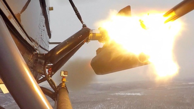 Close-up picture of firing of laser-guided rocket from a H145M helicopter