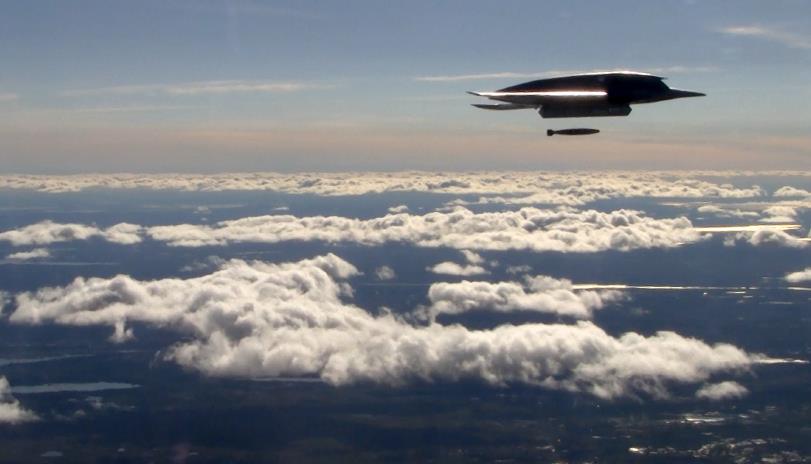 UCAV in the air dropping bomb over Vidsel Test Range
