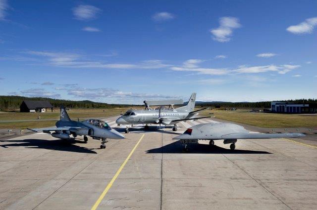 Three airborne platforms standing on the runway at Vidsel Air base