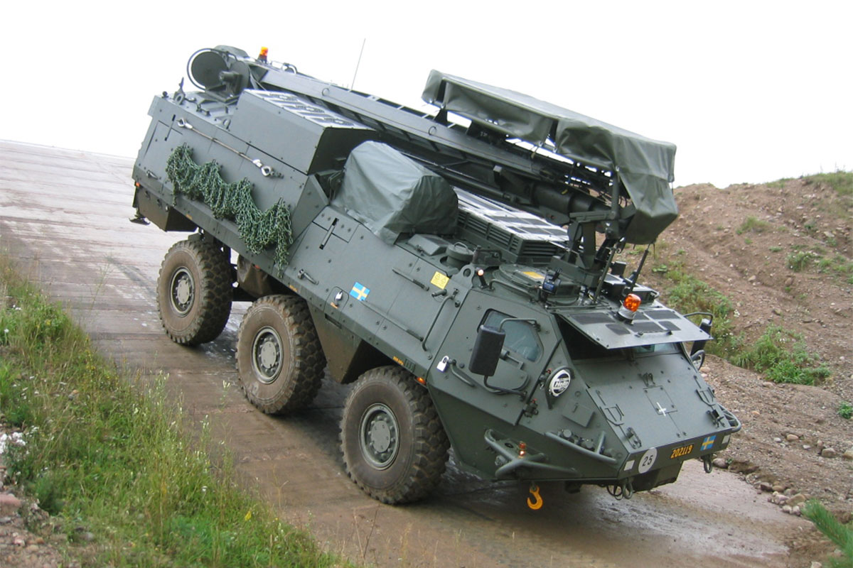 Armoured modular vehicle in mobility test, going downhill