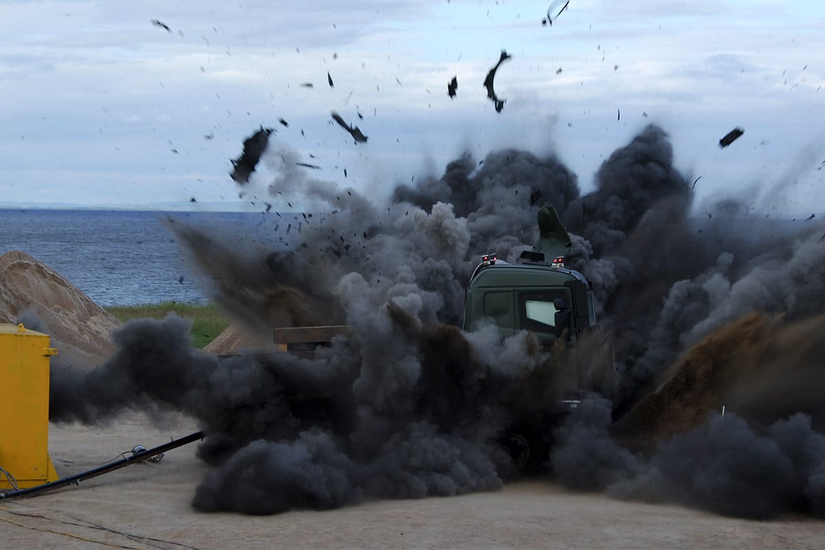 Survivability testing showing a vehicle exploding in black smoke
