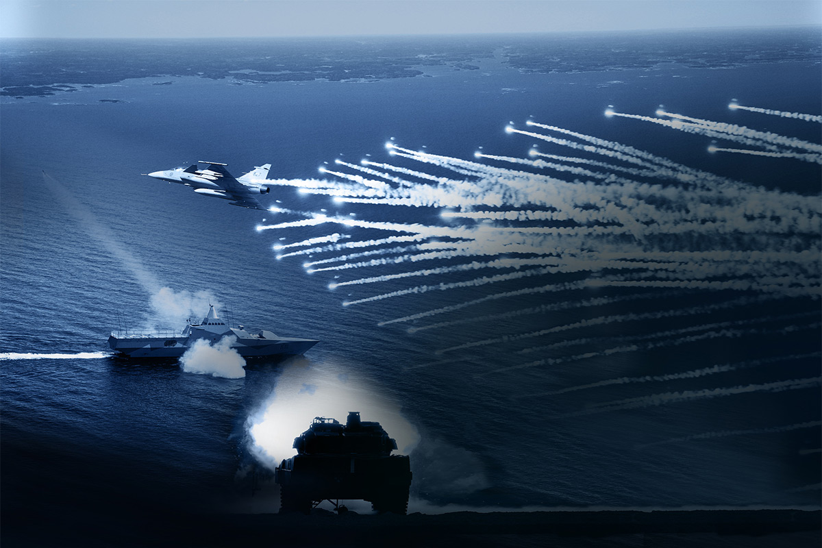 Collage of pictures symbolizing the three domains of the Test and Evaluation Division. A JAS Gripen ejecting flares for the Air domain, a live-firing military vehicle for the Land domain and a Visby corvette for the Naval domain, all in different shades of blue.